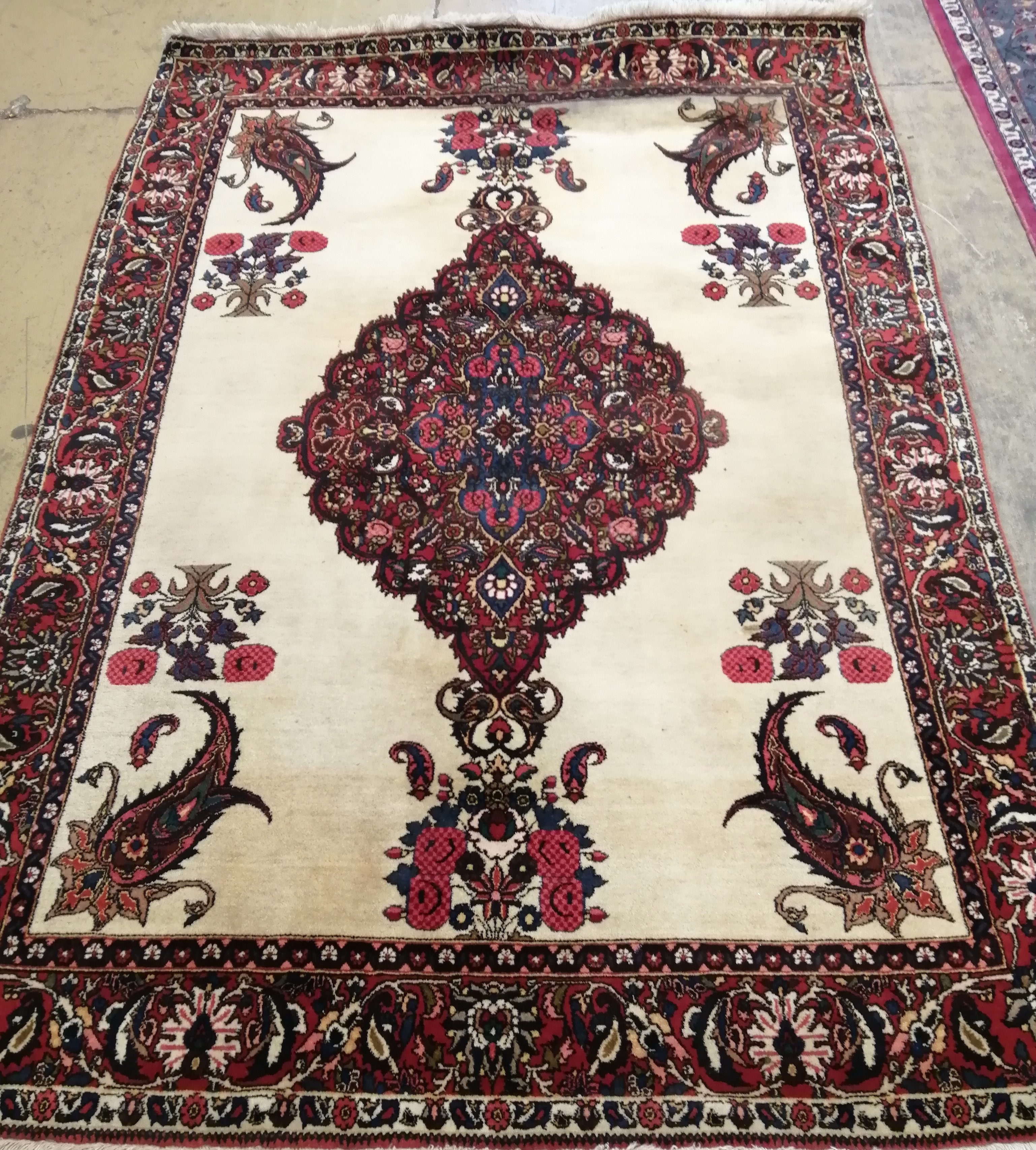 A fine Persian Bakhtiar ivory ground rug, 232 x 150cm